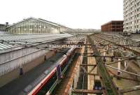 View south from Guild Street bridge over the west side of Aberdeen station on 5 November 2006. On the left a train stands at platform 6 (north) while on the right is the fence that now separates platforms 8&9 from the main station.<br><br>[John Furnevel 05/11/2006]