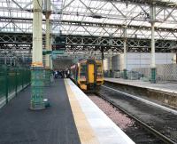 <I>Where are we..? What day is this...? Who are all these people...? </I> Passengers standing on unfamiliar territory. The newly refurbished and reinstated platform 3 at Waverley's east end on 16 December 2006 after the arrival of what had previously been a through service from Newcraighall to Dunblane. These trains are currently terminating here.<br><br>[John Furnevel 16/12/2006]