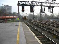 The postal service departs south on the up fast line in the company of a Class 158 on the up slow.<br><br>[Michael Gibb 20/12/2006]