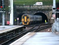 An Alphaline liveried 158 leaving Waverley and entering the non-electrified Mound central tunnel on 20 December 2006 with a service for Dunblane.<br><br>[John Furnevel 20/12/2006]