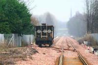 Looking east through the morning mist towards Alloa from Cambus level crossing on 22 December 2006, with ballast trucks standing in the loop and all work suspended for the holiday period. The spire of St Mungo's Church in Bedford Place can be seen in the background through the haze. <br><br>[John Furnevel 22/12/2006]