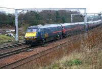 A GNER Glasgow Central - Kings Cross train slows on the approach to Carstairs in December 2006. <br><br>[John Furnevel /12/2006]