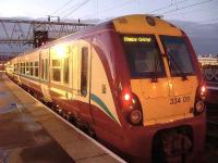 334011 sitting at Platform 11a, Glasgow Central.<br><br>[Graham Morgan 23/12/2006]