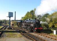 Caprotti Standard class 5 no 73129 gleams in the autumn sunshine as it runs round its train at Rawtenstall in October 2010 during a stay on the East Lancashire Railway. In this view from the end of the station platform the level crossing and signalbox at Rawtenstall West can also be seen.<br><br>[Malcolm Chattwood 25/10/2010]