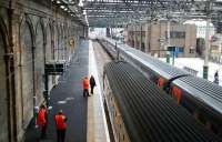 Looking west over platforms 10 and 11 on 28 December with a Glasgow Central via Shotts train and a Glasgow - Kings Cross service present.<br><br>[John Furnevel 28/12/2006]