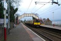 Glasgow bound train at Langbank. No trace remains of the station building I saw on my last visit. A (cough) few years ago.<br><br>[Ewan Crawford 03/01/2007]