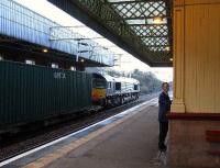 66402 with the daily WH Malcolm container service from Grangemouth to Elderslie passes through Paisley Gilmour Street<br><br>[Graham Morgan 06/01/2007]