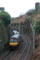 Helensburgh train heading west for the twin tunnels under Brucehill.<br><br>[Ewan Crawford 05/01/2006]