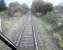 Site of Bridge of Earn Junction Oct 2006. Trackbed of the main line via Kinross bears right through the undergrowth while the remaining branch line via Ladybank continues straight ahead. Note change of mileage. <br><br>[Gary Straiton /10/2006]