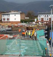 Pedestrian entrance - view north over the A907 towards Alloa station on 8 January 2006. Work continues on the station building, while beyond that a supply of sleepers has been stacked against the wall on the north side of the line. The Ochil Hills form the backdrop.  <br><br>[John Furnevel 08/01/2007]