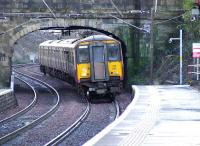 318267 & 318264 pulling into Johnstone with an Ayr service<br><br>[Graham Morgan 09/01/2007]