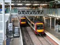 With more engineering work underway at the west end of Waverley, Glasgow shuttle services are seen here using the northside through platforms 19 and 20 on 14 January 2007.<br><br>[John Furnevel 14/01/2007]