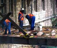 Suitably attired and equipped team of demolition specialists - Waverley, 2006.<br><br>[Darren Gallagher /05/2006]