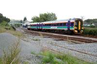 Eastbound service leaves Garve.<br><br>[Ewan Crawford 22/07/2004]