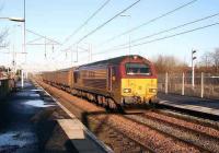 Aberdeen - Mossend empty parcels vans run south through Coatbridge Central on 16 Jan 2007 behind EWS 67030. <br><br>[John Furnevel 16/01/2007]