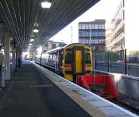 A train for Bathgate standing at Haymarket platform 0, complete with its recently completed new canopy, on 15 January 2007.<br><br>[John Furnevel 15/01/2007]