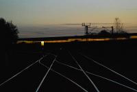 Newark Flat Level Crossing at night. A GNER train speeds south. Taken from the road crossing.<br><br>[Ewan Crawford 18/11/2006]
