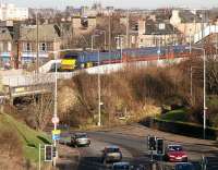 A GNER Kings Cross - Glasgow Central service heads west through Slateford station on 25 January 2007 and is just about to cross Slateford Road. <br><br>[John Furnevel 25/01/2007]