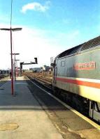 Driver of class 47 <I>The Commonwealth Spirit</I> looks back down the platform for the guards signal at Basingstoke on 26 January 1990. <br><br>[John McIntyre 26/01/1990]