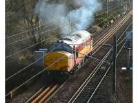 EWS 37406 <I>The Saltire Society </I>, lit by a low winter sun, arrives back at Millerhill on 26 January 2007 having worked the early morning Powderhall - Oxwellmains <I>Binliner</I>.<br><br>[John Furnevel 26/01/2007]