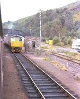 Trains passing at Garve in 1982.<br><br>[Unknown //1982]