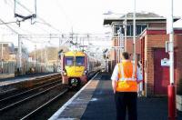 <I>Take this to your leader!</I> Milngavie - Lanark service pulls into Newton station where an urgent message awaits, Jan 2007.<br><br>[John Furnevel /01/2007]