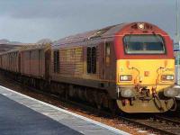 67003 heads south through Dalwhinnie with five utility vans on 26 January.<br><br>[John Gray 26/01/2007]