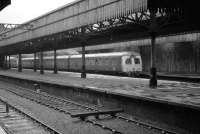 Demolition work in progress at Aberdeen in 1973. Looking across the blocked platforms 6 and 7 at a departing Inverness service temporarily switched to platform 9.<br><br>[John McIntyre /09/1973]