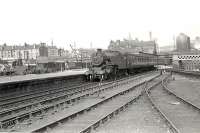 42143 passing Partick Central on a Rutherglen - Balloch train in the summer of 1957. View is east with the River Kelvin on the right and the station building on Benalder Street visible above the locomotive.<br><br>[G H Robin collection by courtesy of the Mitchell Library, Glasgow 06/08/1957]