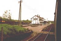 Taynuilt Station looking west. The goods yard sidings are full of ballast wagons.<br><br>[John Gray /08/1984]