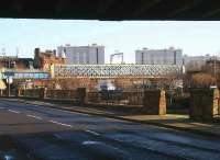 Looking east from below the bridge leaving Coatbridge Central towards the lattice girder bridge carrying the Sunnyside - Whifflet South Junction freight line over the Monkland Canal basin in Jan 2007.<br><br>[John Furnevel /01/2007]