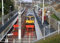 View north over Larkhall station following a shower of rain on 31 January 2007, with a train for Dalmuir standing at platform 2.  <br><br>[John Furnevel 31/01/2007]