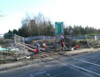 The former Hilton Road level crossing in February 2007.  Workers tighten bolts connecting the new track for the SAK. This crossing was made redundant by a new overbridge to the east.<br><br>[Brian Forbes 02/02/2007]