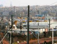 View east over Slateford yard on Sunday 4 February 2007 showing First ScotRail stock occupying the west end of the stabling sidings. Beyond that in the south east corner of the yard is the PW shed, surrounded by numerous track machines.<br><br>[John Furnevel 04/02/2007]