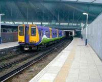 Class 313 at the 'North London Line' platforms at Stratford in 2004. This is now the terminus for NLL services from Richmond following absorption of much of the former route to North Woolwich by the DLR in late 2006.<br><br>[Michael Gibb 22/12/2004]