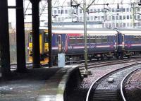 Looking past Muirhouse junction with a 156 in First ScotRail colours passing.<br><br>[Colin Harkins 10/02/2007]