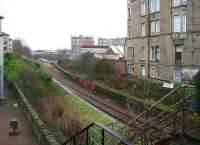 Looking over Easter Road station on 12 February 2007. The line runs to Piershill Jct where it joins the ECML, while the trackbed bearing right and now fenced off once led to Abbeyhill. The white platform sign still proclaims <I>Easter Road Junction</I>. <br><br>[John Furnevel 12/02/2007]