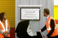 Transport Minister Tavish Scott unveils a commemorative plaque marking the official opening of new facilities at Haymarket depot on 13 February 2007. First ScotRail's Managing Director Mary Dickson looks on.<br><br>[Ian Watson, Studio Scotland 13/02/2007]