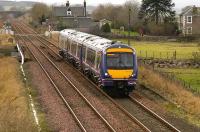 11.42 Queen Street - Aberdeen service heads north at Forteviot on 16 February having just crossed the Water of May viaduct.<br><br>[Bill Roberton 16/02/2007]