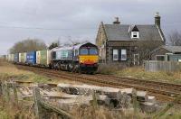 66416 passes the old station house at Forteviot with a Grangemouth - Aberdeen Intermodal working on 16 February. In the foreground is the site of the old SB.<br><br>[Bill Roberton 16/02/2007]