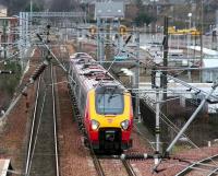 A Voyager passing Slateford yard westbound on 16 February 2007. First ScotRail DMUs can be seen in the background on the stabling and cleaning roads recently built along the north side of the yard.   <br><br>[John Furnevel 16/02/2007]