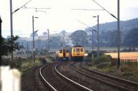 Old and new at Ardmore in 1979 with a 303 service bound for Airdrie passing a 314 on a test run.<br><br>[John McIntyre //1979]