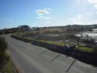 Raiths Farm: North end of site, on Pitmedden Road, looking south. Aberdeen-Inverness line on embankment to the left.<br><br>[John G. Williamson 17/02/2007]