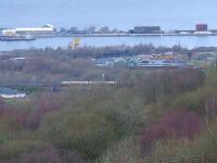 A Class 334 approaching Cartsdyke passes the location of Ladyburn Shed in Greenock.<br><br>[Graham Morgan 20/01/2007]