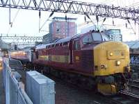 37410 hauling away the empty Caledonian Sleeper from Glasgow Central. On this particular day the Sleeper filled the whole of Platform 11.<br><br>[Graham Morgan 25/01/2007]