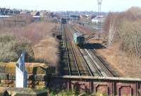 An eastbound service leaving Carlisle on the Newcastle line passes the site of London Road yard and shed. On the far left running alongside is the Settle & Carlisle route. The two lines meet in the distance at Petteril Bridge Junction.<br><br>[John Furnevel 26/02/2007]