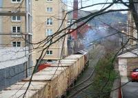 The driver of 66230 applies the Order of the Boot as the morning <I>Binliner</I> pulls away from Powderhall refuse depot on 1 March 2007 with a full load of compacted waste containers.<br><br>[John Furnevel 01/03/2007]