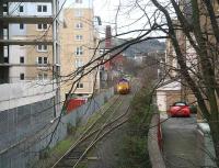 Early morning prowler. 66230 creeps along the Powderhall branch to pick up the morning <I>Binliner</I> for Oxwellmains on 1 March 2007.  <br><br>[John Furnevel 01/03/2007]