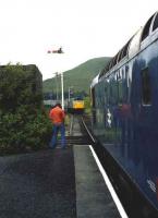  26042 stands at Achnasheen waiting to cross an up train in 1979. <I>(He is definitely taking a picture.)</I><br><br>[John McIntyre //1979]