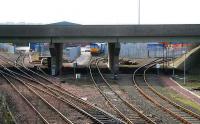 View west from Fouldubs Junction on 5 March with the SB just off picture to the right. Lines to the left head for Grahamston while in the centre the <i>Tesco</i> container train can be seen through the M9 motorway supports standing in the WHM depot.<br><br>[John Furnevel /03/2007]